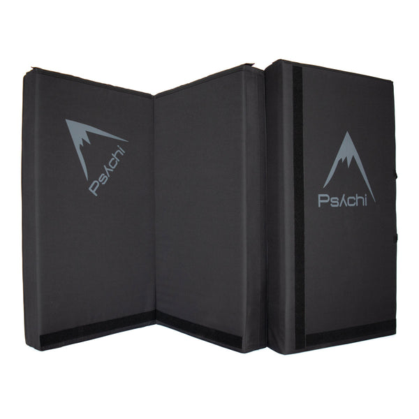 A black psychi bouldering crash pad dual layer triple fold 