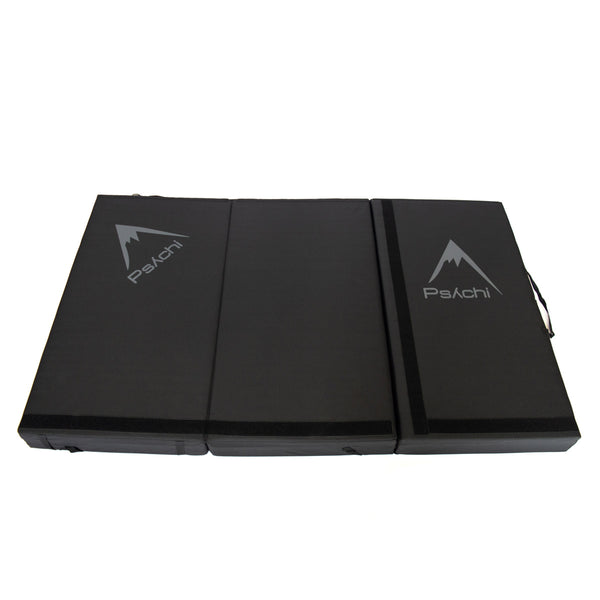 A black psychi bouldering crash pad dual layer triple fold 