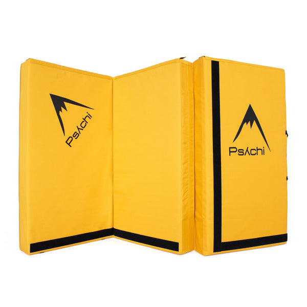 A yellow psychi bouldering crash pad dual layer triple fold 