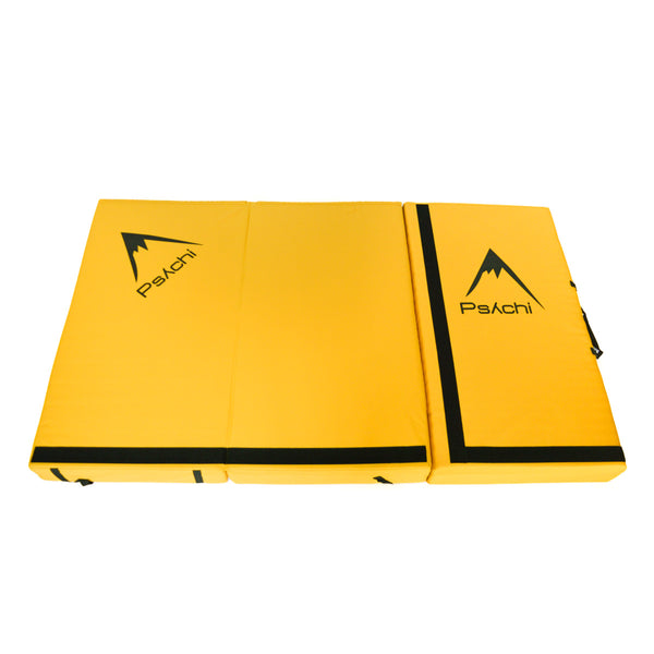 A yellow psychi bouldering crash pad dual layer triple fold 