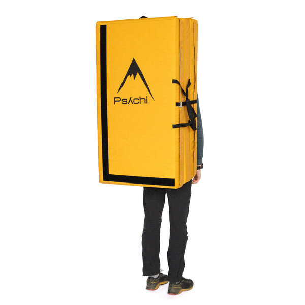 A yellow psychi bouldering crash pad dual layer triple fold 