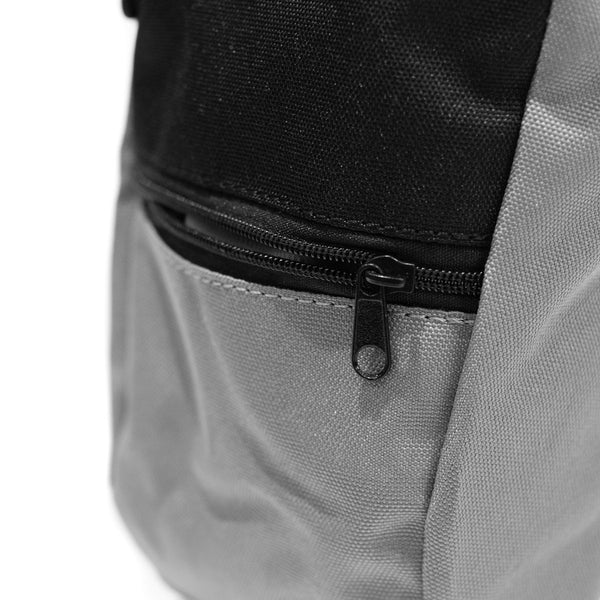 A light grey rock climbing chalk bag with zip closure climbing accessory pocket