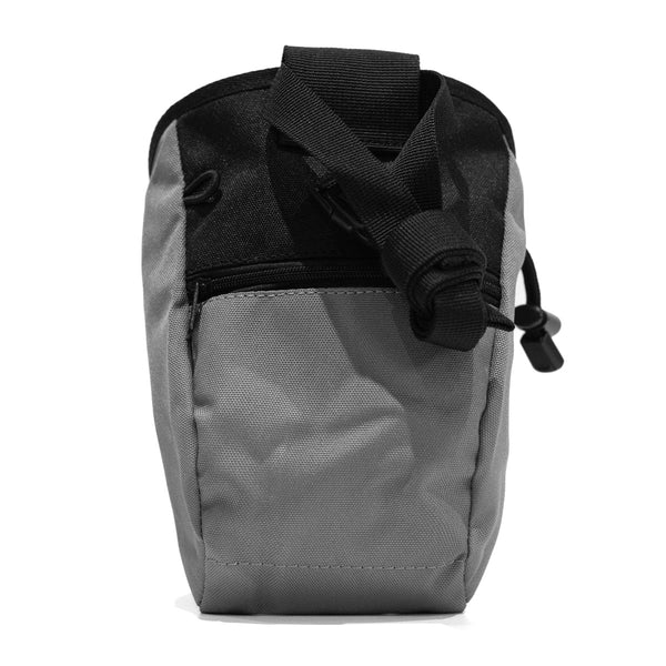 A light grey climbing chalk bag with a zip closure accessory pocket and strong nylon waist strap