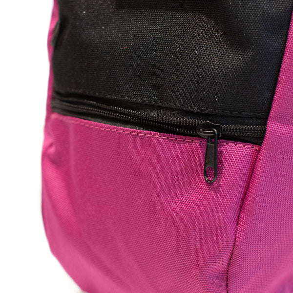 A magenta rock climbing chalk bag with zip closure climbing accessory pocket