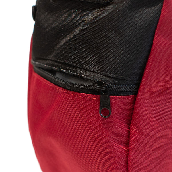 A red rock climbing chalk bag with zip closure climbing accessory pocket