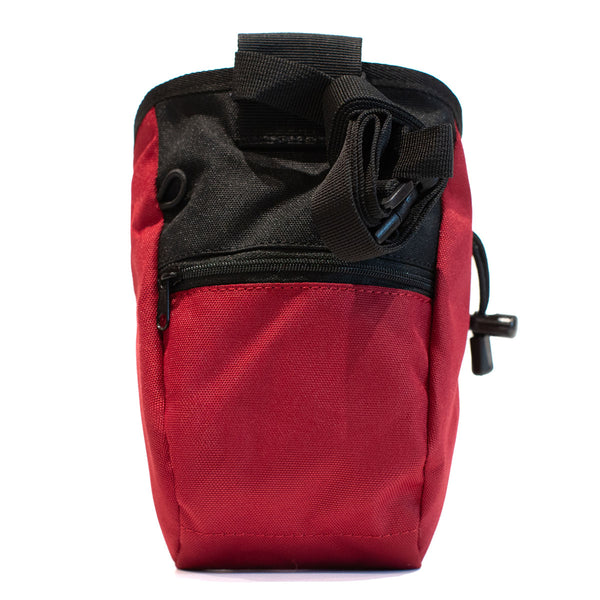 A red climbing chalk bag with a zip closure accessory pocket and strong nylon waist strap