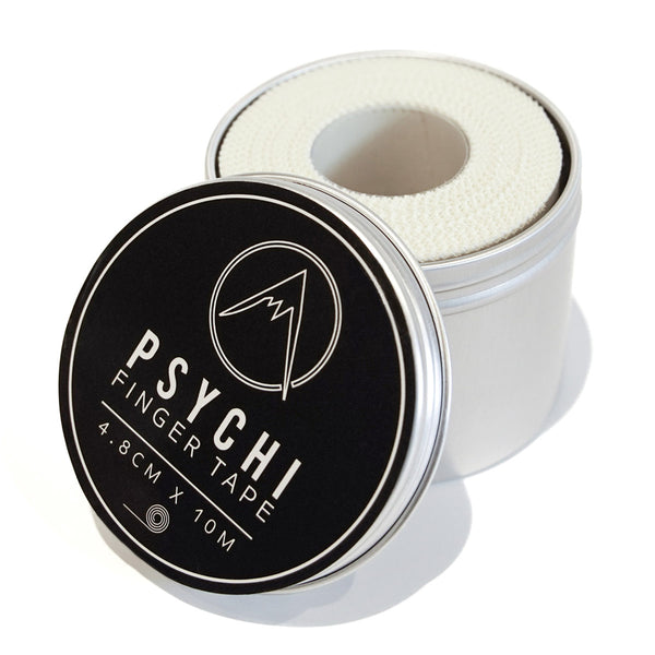 A roll of zinc oxide sports strapping tape in a carry tin 