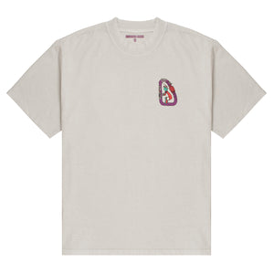 An off-white, oversized bouldering t-shirt with a purple and orange carabiner logo featuring a climber with a mushroom for a head.