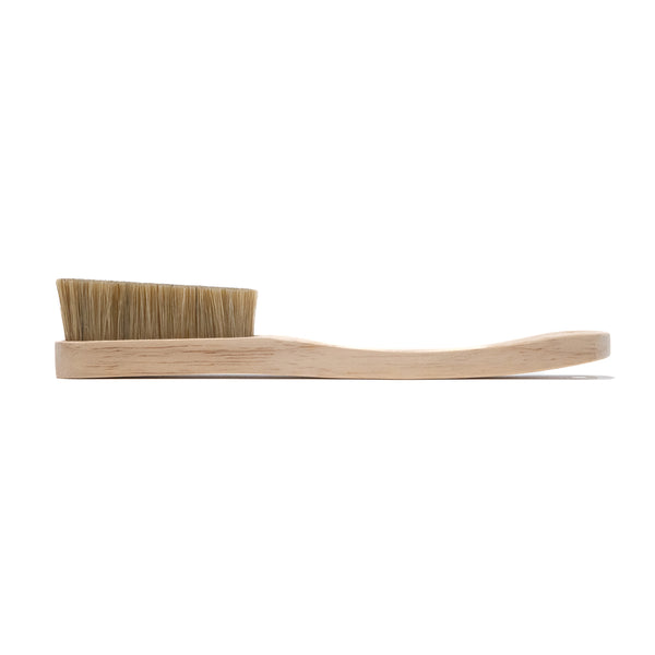 A wooden climbing brush with boar hair bristles